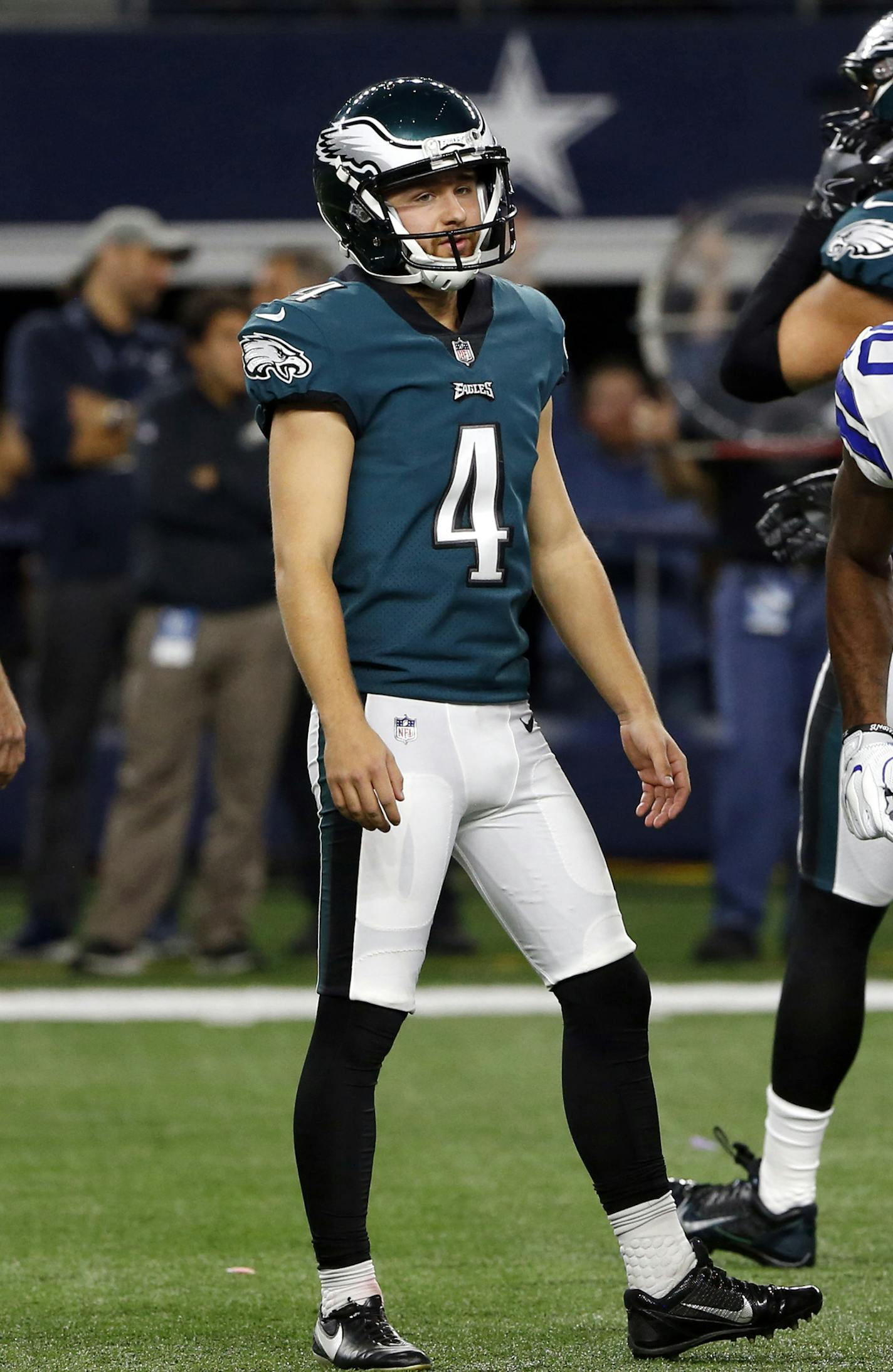 Philadelphia Eagles' Donnie Jones (8) and Jake Elliott (4) watch as Dallas Cowboys' Anthony Brown (30) and others celebrate a missed field goal attempt by Elliott in the first half of an NFL football game, Sunday, Nov. 19, 2017, in Arlington, Texas. (AP Photo/Ron Jenkins) ORG XMIT: CBS122