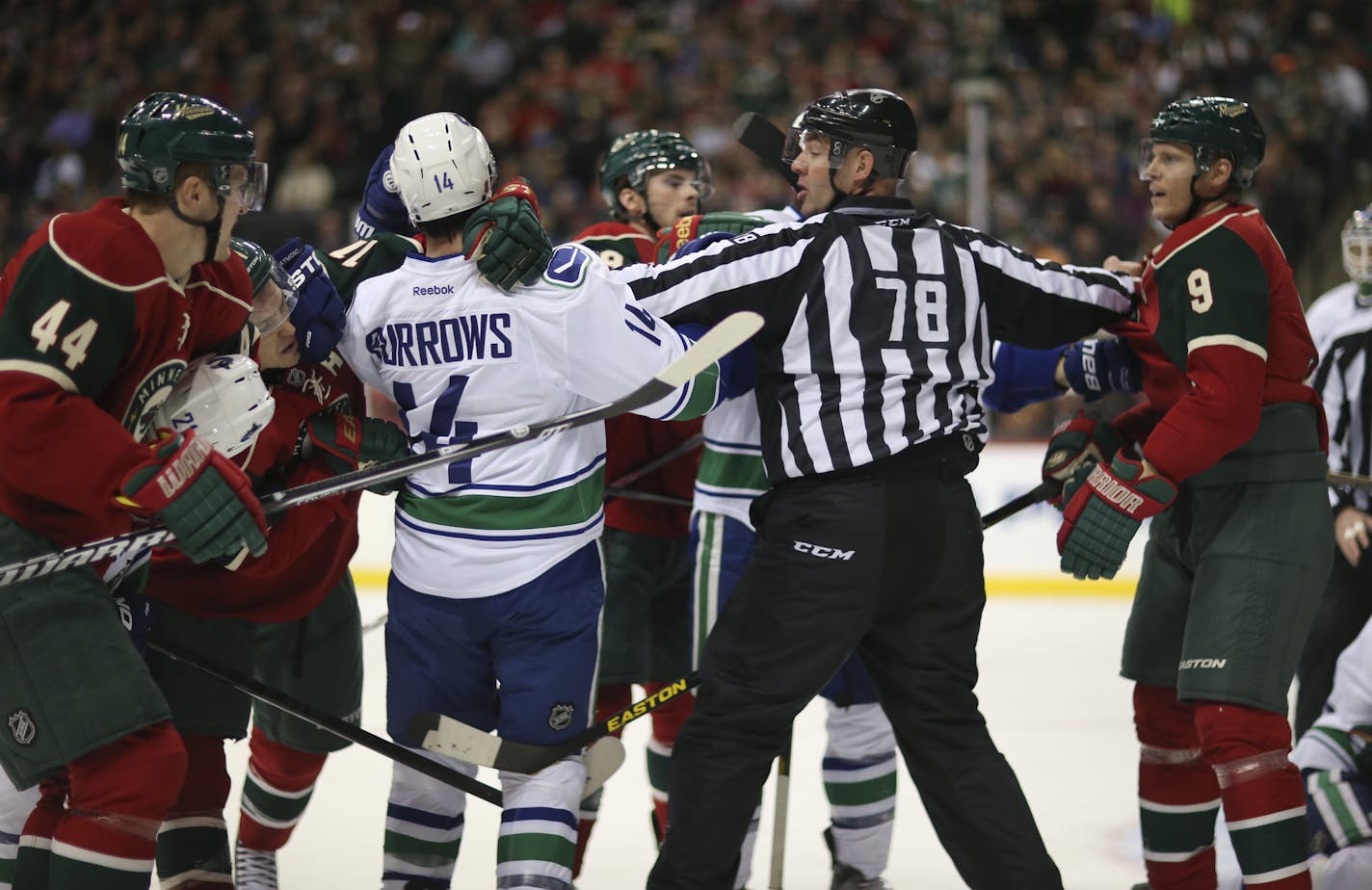 The Minnesota Wild faced the Vancouver Canucks in an NHL hockey game Sunday night, March 10, 2013 at Xcel Energy Center in St. Paul, Minn. Referee Brian Mach separated the Wild's Mikko Koivu, right from the Canucks' Alexandre Burrows during one of several first period altercations between the teams. ] JEFF WHEELER &#x201a;&#xc4;&#xa2; jeff.wheeler@startribune.com