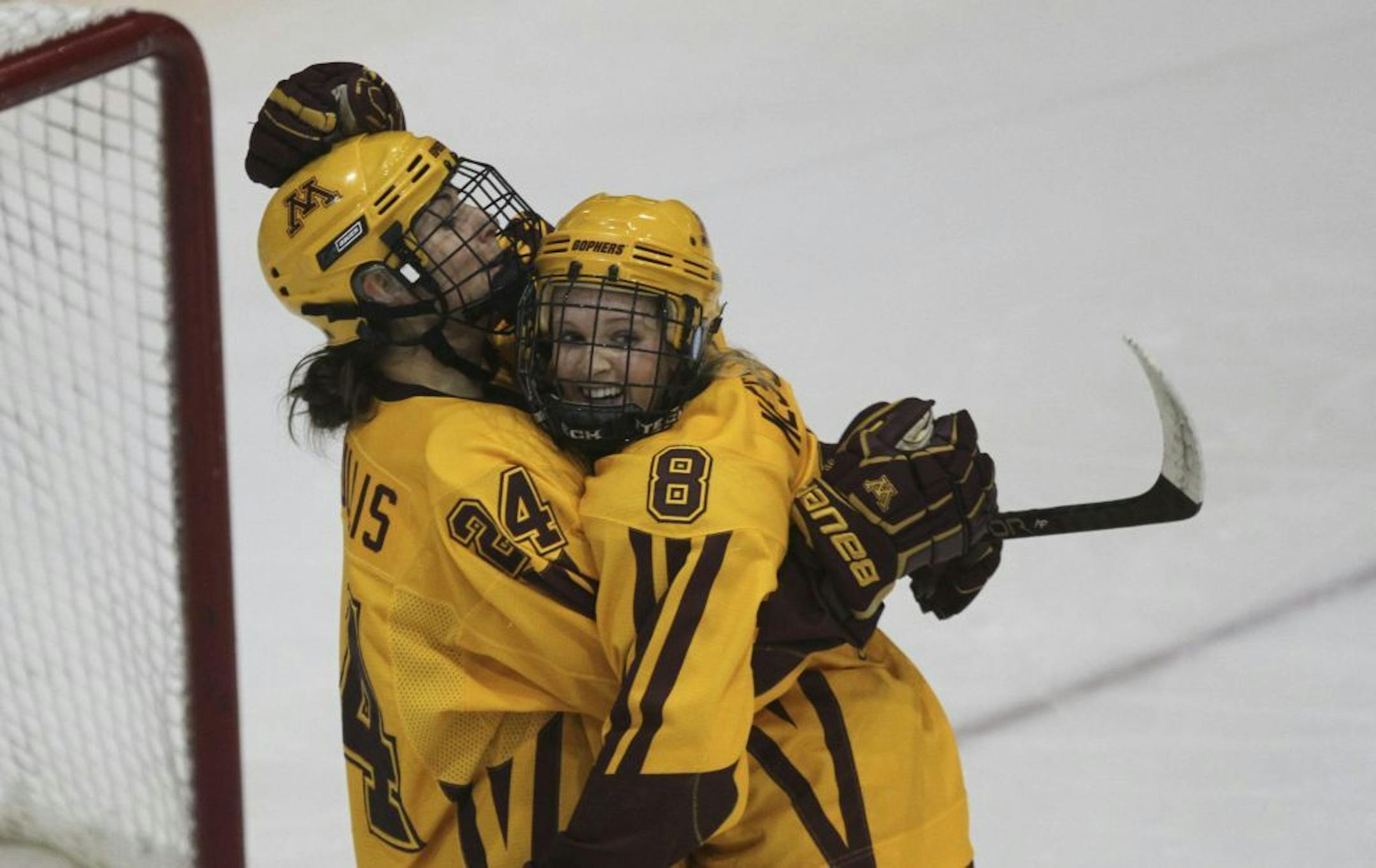 Minnesota's Amanda Kessel celebrated her shorthanded goal with teammate Jen Schoullis during the second period at Ridder Arena in Minneapolis on Saturday.
