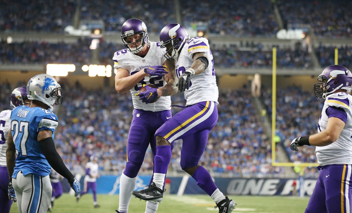 Minnesota Vikings tight end Kyle Rudolph (82) left and Adrian Peterson celebrated his second quarter touchdown catch at Ford Field Sunday October 25, 2015 in Detroit, MI.