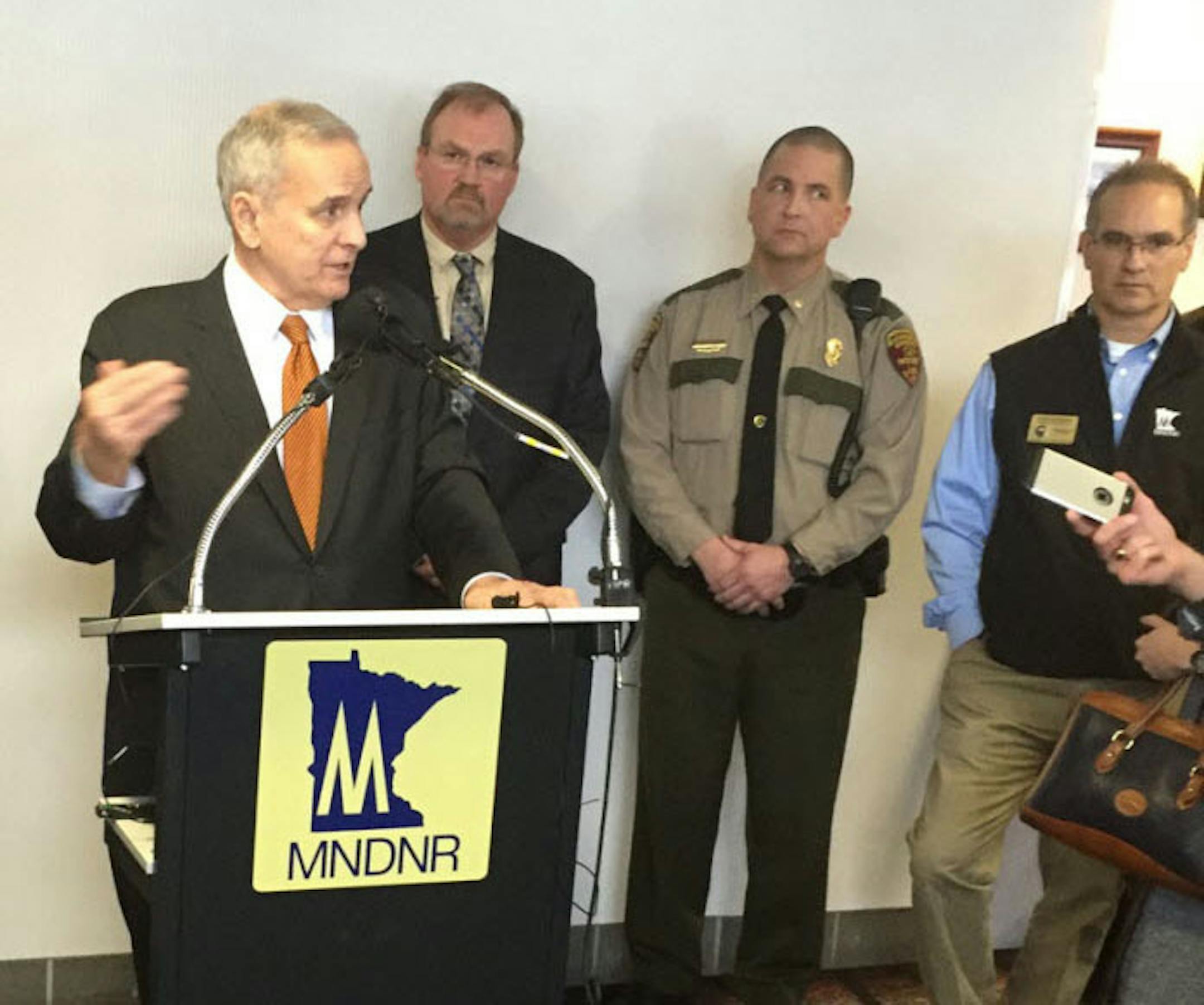 Minnesota Gov. Mark Dayton discusses his proposal for tougher penalties against poachers on Friday in Brooklyn Center.