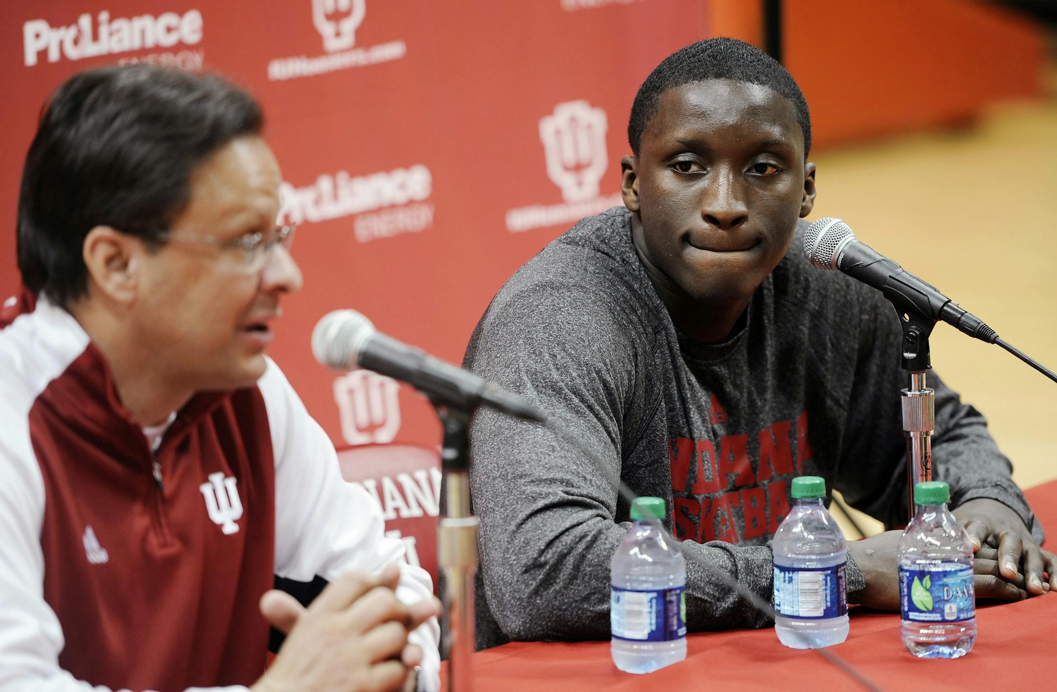 Indiana junior Victor Oladipo listens to men's basketball coach Tom Crean, left, during a news conference at Assembly Hall in Bloomington, Ind., Tuesday, April 9, 2013. Oladipo announced that he plans to enter the NBA draft. (AP Photo/The Herald-Times, Chris Howell) ORG XMIT: MIN2013051419412279