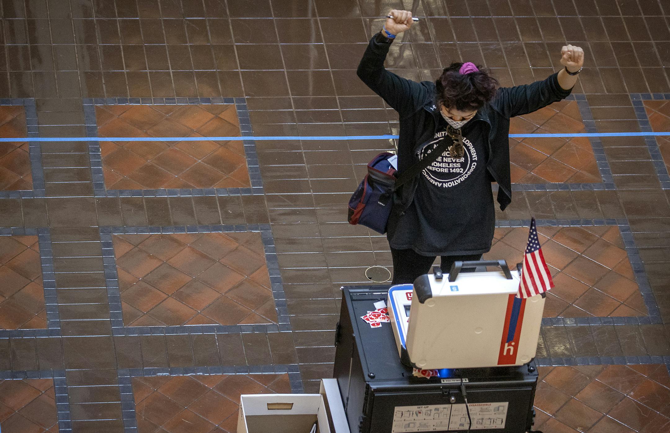Jess Grams, cq, cheered after she watched her ballot go through the ballot box after she voted at the Landmark Center Tuesday, November 3, 2020 in St. Paul, MN. ] ELIZABETH FLORES • liz.flores@startribune.com