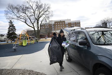 Krystle D'Alencar, a recently laid-off worker from Tattersall Distilling, brought supplies to donate to vulnerable communities at Peavey Park Saturday