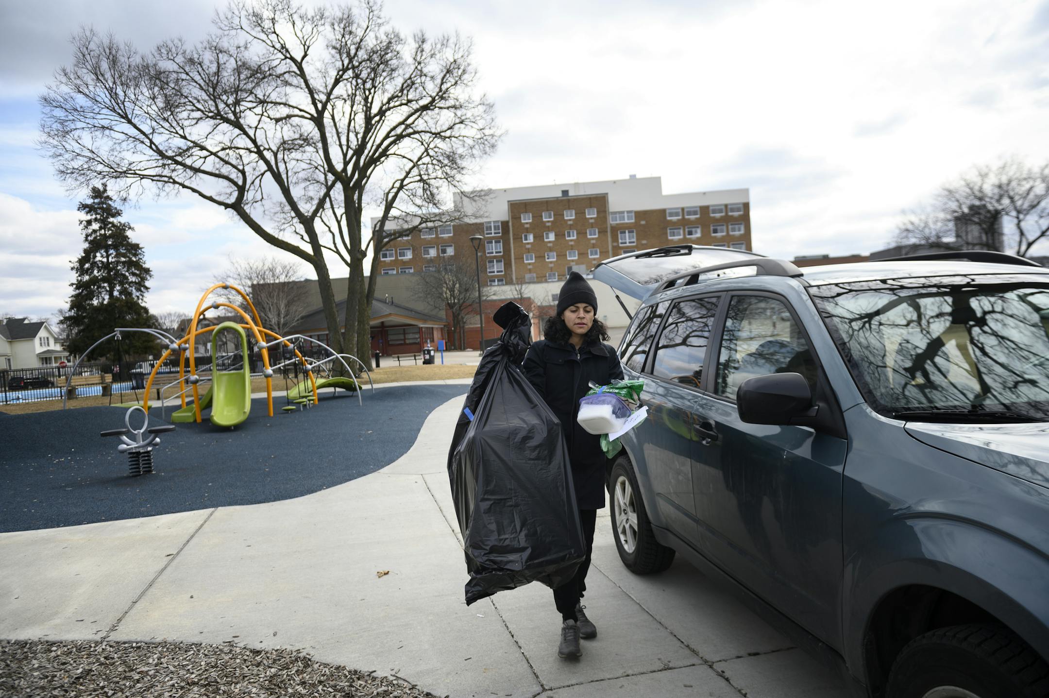 Krystle D'Alencar, a recently laid-off worker from Tattersall Distilling, brought supplies to donate to vulnerable communities at Peavey Park Saturday, including hand sanitizer made at Tattersall, wipes, and plastic sheeting that could be used instead of cardboard. The donation event was organized by the Cultural Wellness Center. ] Aaron Lavinsky • aaron.lavinsky@startribune.com Aid workers distributed essential goods to vulnerable communities at Peavey Field Park on Saturday, March 21, 2020 in