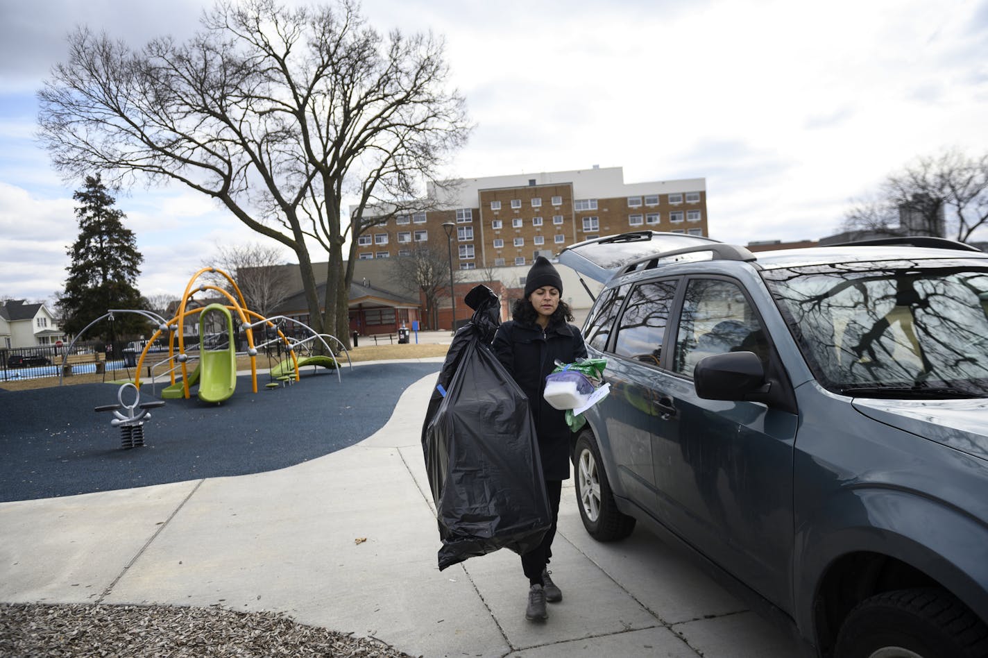 Krystle D'Alencar, a recently laid-off worker from Tattersall Distilling, brought supplies to donate to vulnerable communities at Peavey Park Saturday, including hand sanitizer made at Tattersall, wipes, and plastic sheeting that could be used instead of cardboard. The donation event was organized by the Cultural Wellness Center. ] Aaron Lavinsky • aaron.lavinsky@startribune.com Aid workers distributed essential goods to vulnerable communities at Peavey Field Park on Saturday, March 21, 2020 in