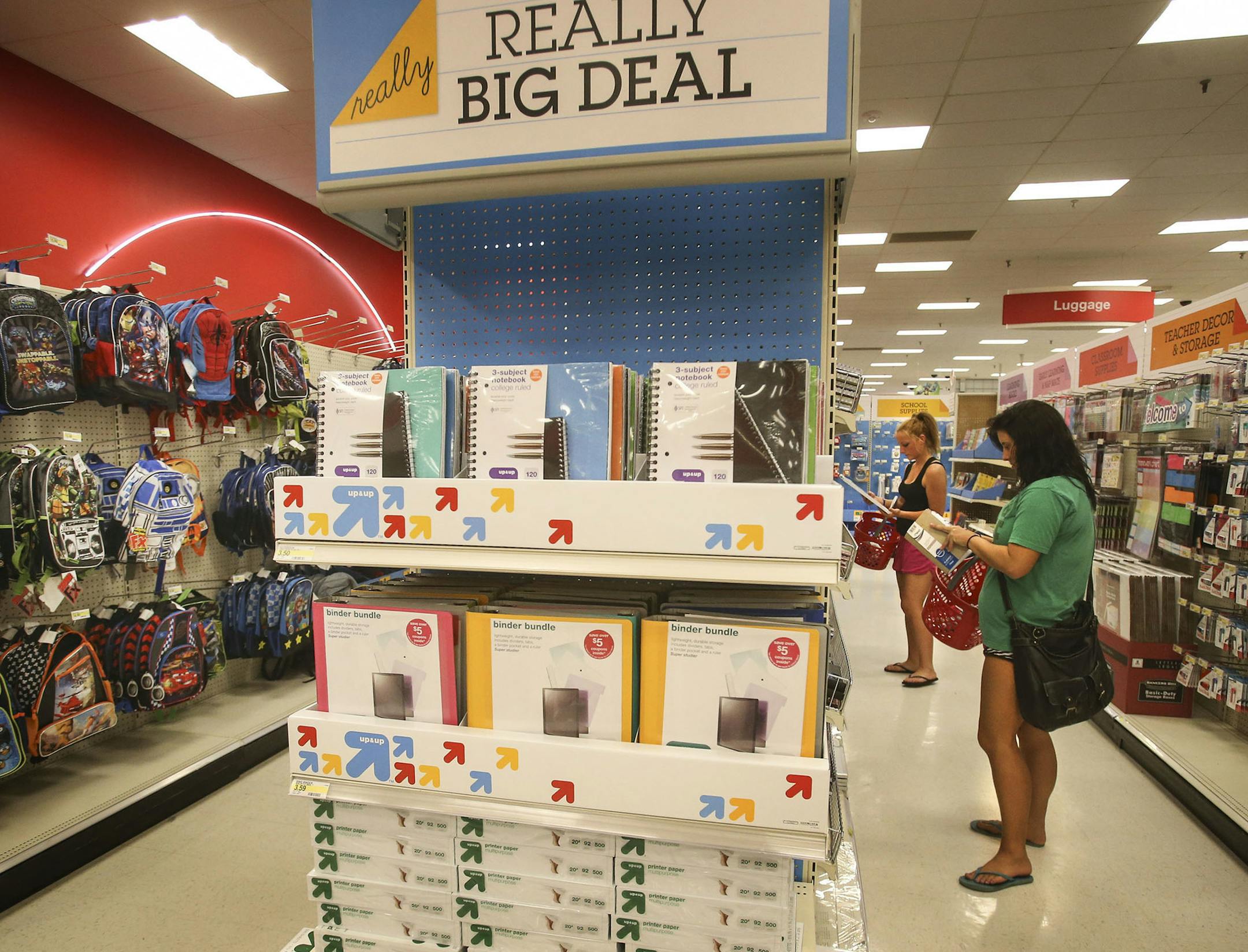 The back-to-school section is taking shape, a mere few days past July 4th, and seen at Target Tuesday, July 9, 2014, in Bloomington, MN. Here, Amelia Blommel, rear, and Sarah Pitman, front, neither of whom are students, took advantage of fresh supplies that had yet to be picked over by back-to-school shoppers.]] (DAVID JOLES/STARTRIBUNE) djoles@startribune Target unveils a new back-to-school promotion this year.**Amelia Blommel and Sarah Pitman, cq