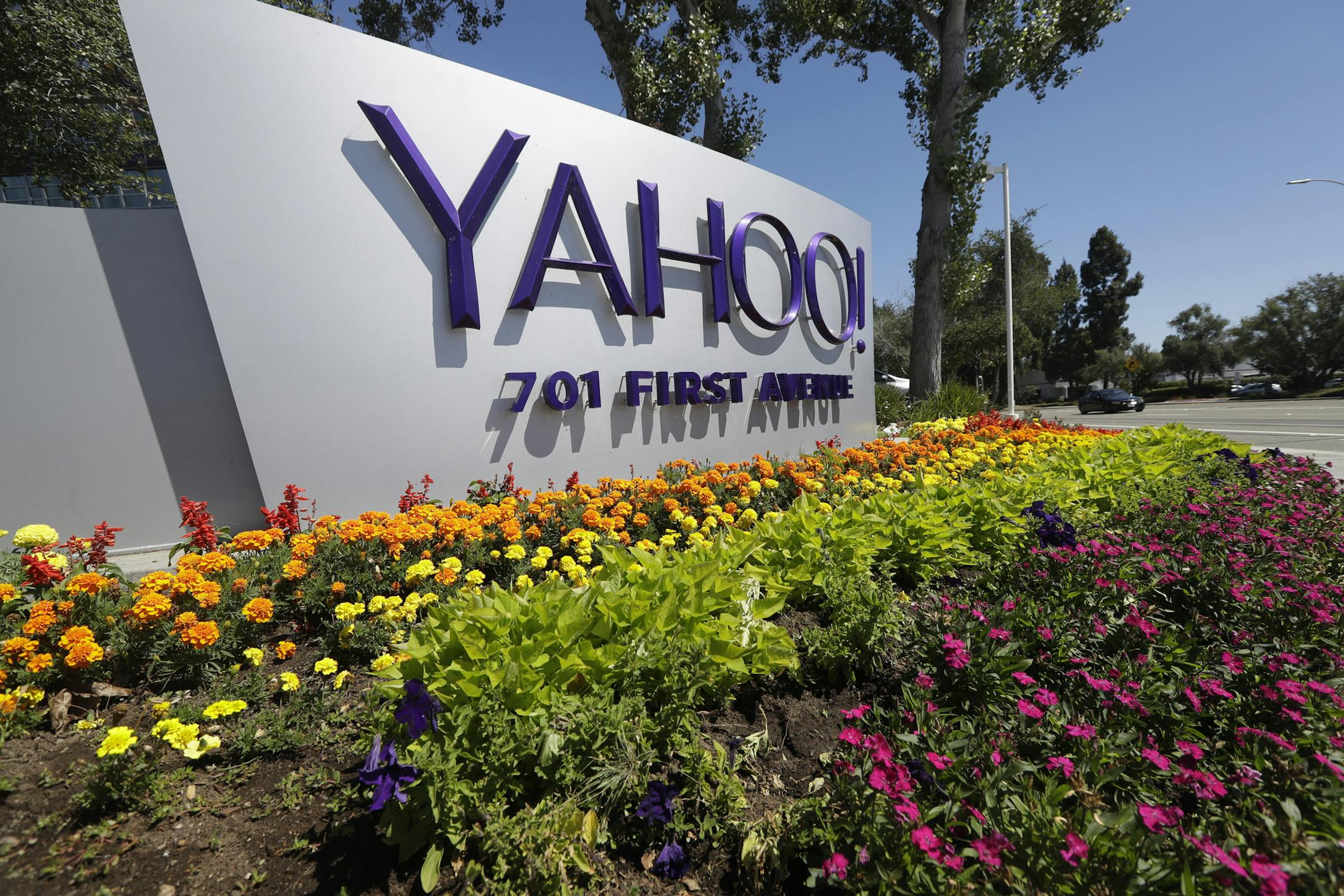 FILE - This Tuesday, July 19, 2016 photo shows a Yahoo sign at the company's headquarters in Sunnyvale, Calif. On Wednesday, Dec. 14, 2016, Yahoo said it believes hackers stole data from more than one billion user accounts in August 2013. (AP Photo/Marcio Jose Sanchez)