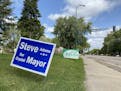 Mayoral campaign signs on a Crystal boulevard