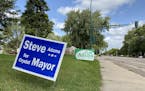 Mayoral campaign signs on a Crystal boulevard