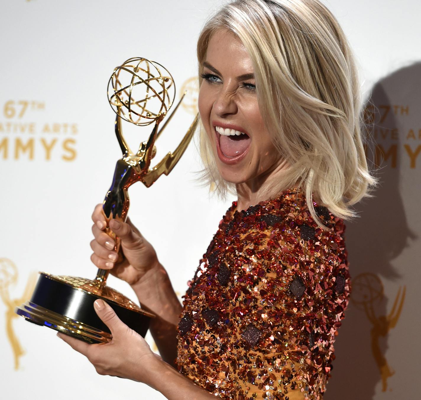 Julianne Hough, co-winner of the award for outstanding choreography for "Dancing with the Stars," poses in the press room at the Creative Arts Emmy Awards at the Microsoft Theater on Saturday, Sept. 12, 2015, in Los Angeles. (Photo by Chris Pizzello/Invision/AP)