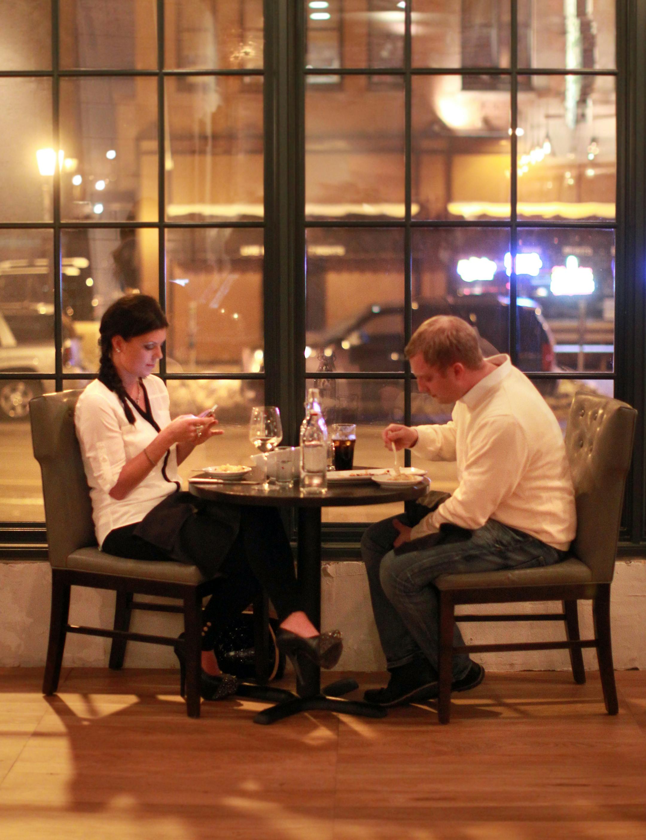Jennifer Nelson uses her smart phone while she and her brother Gabe Nelson broke bread along the windows of the borough's dining room friday night . __ The Smack Shack and 'Borough' two of many restaurants that are luring the young foodies in with great food. [ TOM WALLACE &#x2022; twallace@startribune.com _ Assignments #20027523A_ Feburary 8, 2013_ SLUG: 744466 youngfoodies _ EXTRA INFORMATION: magic saxo number is 744466 __ Young foodies spending their disposable income on good food in area re