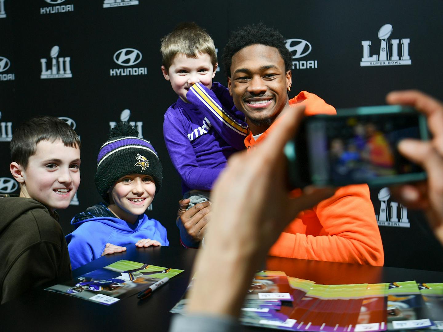 The Balgaard brothers, Brady, 12, Tayson, 10,and Max, 4, got a photo with Stefon Diggs. ] GLEN STUBBE &#xef; glen.stubbe@startribune.com Monday, January 29, 2018 Stefon Diggs signs autographs at Hyundai Activation area of Super Bowl Experience at the Convention Center.