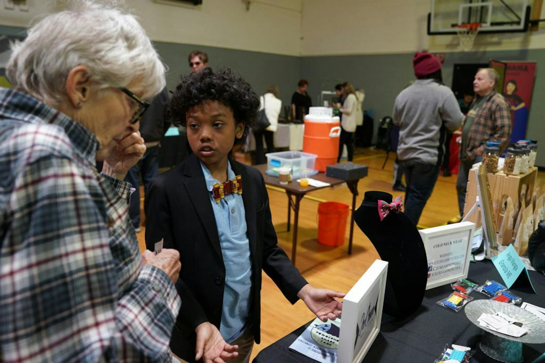 Brooke Anthony of Minneapolis talked with Aniki Allen, 9, about his business Ice Cream Bow Ties that creates bow ties from Lego bricks.