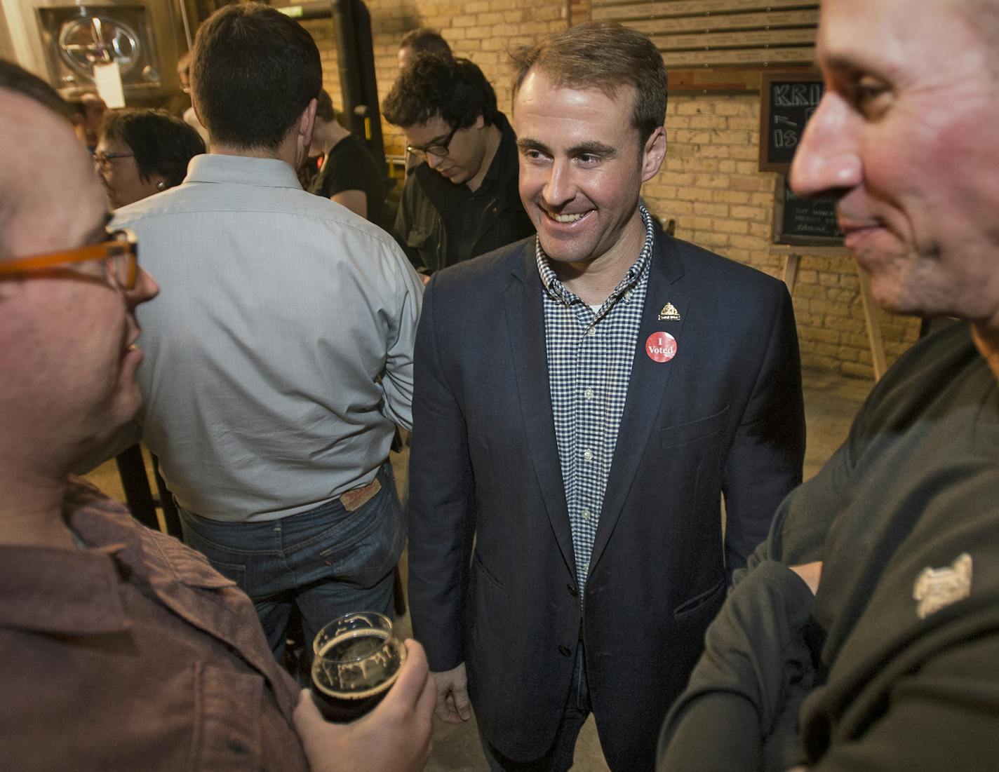 Saint Paul City Council Ward 3 candidate Chris Tolbert, center, spoke to constituent Jeff Zaayer, left, and John Regal, incoming Saint Paul Area Chamber of Commerce chair for 2016, during the DFL election party at Urban Growler Tuesday night. ] (AARON LAVINSKY/STAR TRIBUNE) aaron.lavinsky@startribune.com All seven of St. Paul's City Council seats are up for election, including two open wards where incumbents didn't run again. As many as three who have challenged Mayor Chris Coleman's goals and s