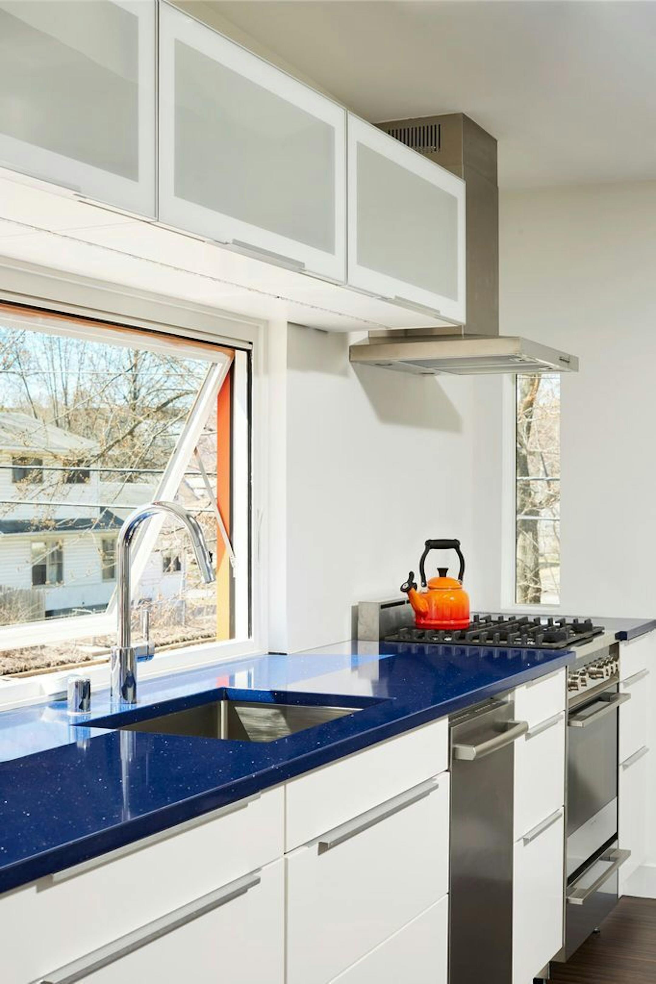 Blue countertops highlight the kitchen.