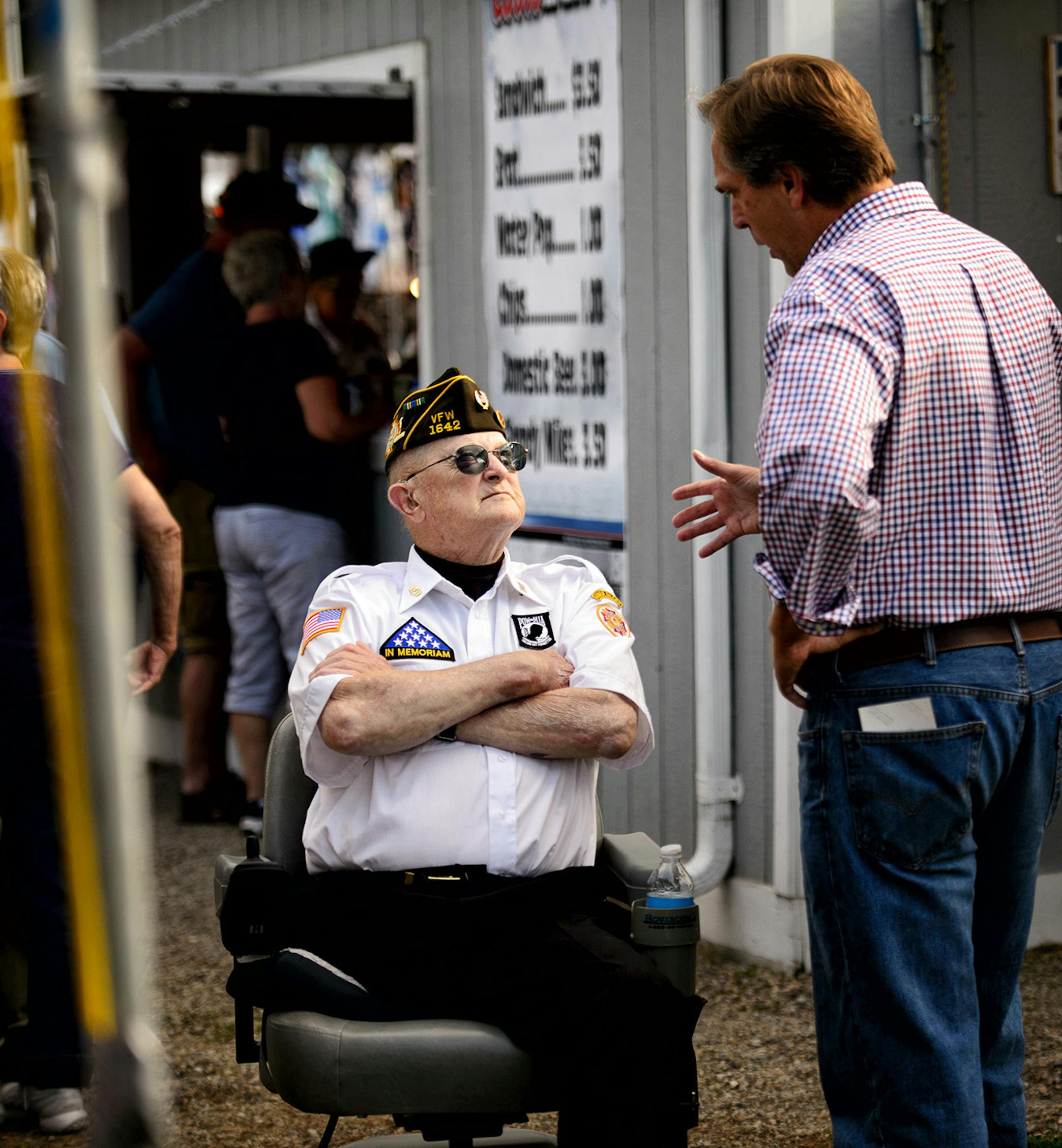When asked who he was going to vote for, VFW member Delency Sutlief, 79 said "anybody but the incumbents." He talked with GOP Senate candidate Mike McFadden in the American Legion area of the Waseca County Free Fair, Wednesday, July 16, 2014. ] GLEN STUBBE * gstubbe@startribune.com EDS, Delency Sutlief is cq