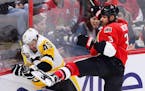 Pittsburgh Penguins right wing Josh Archibald (45) is checked by Ottawa Senators defenseman Marc Methot (3) during the first period of Game 4 of the N