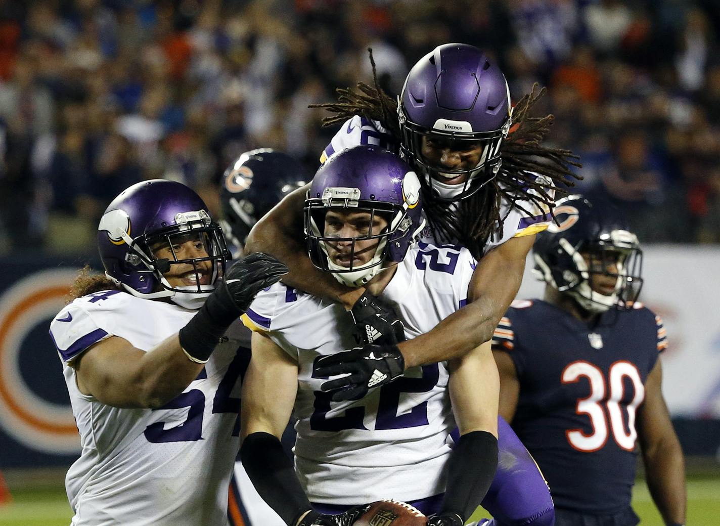 Minnesota Vikings free safety Harrison Smith (22) celebrates with teammates after intercepting a pass during the second half of an NFL football game against the Chicago Bears, Monday, Oct. 9, 2017, in Chicago. (AP Photo/Charles Rex Arbogast)