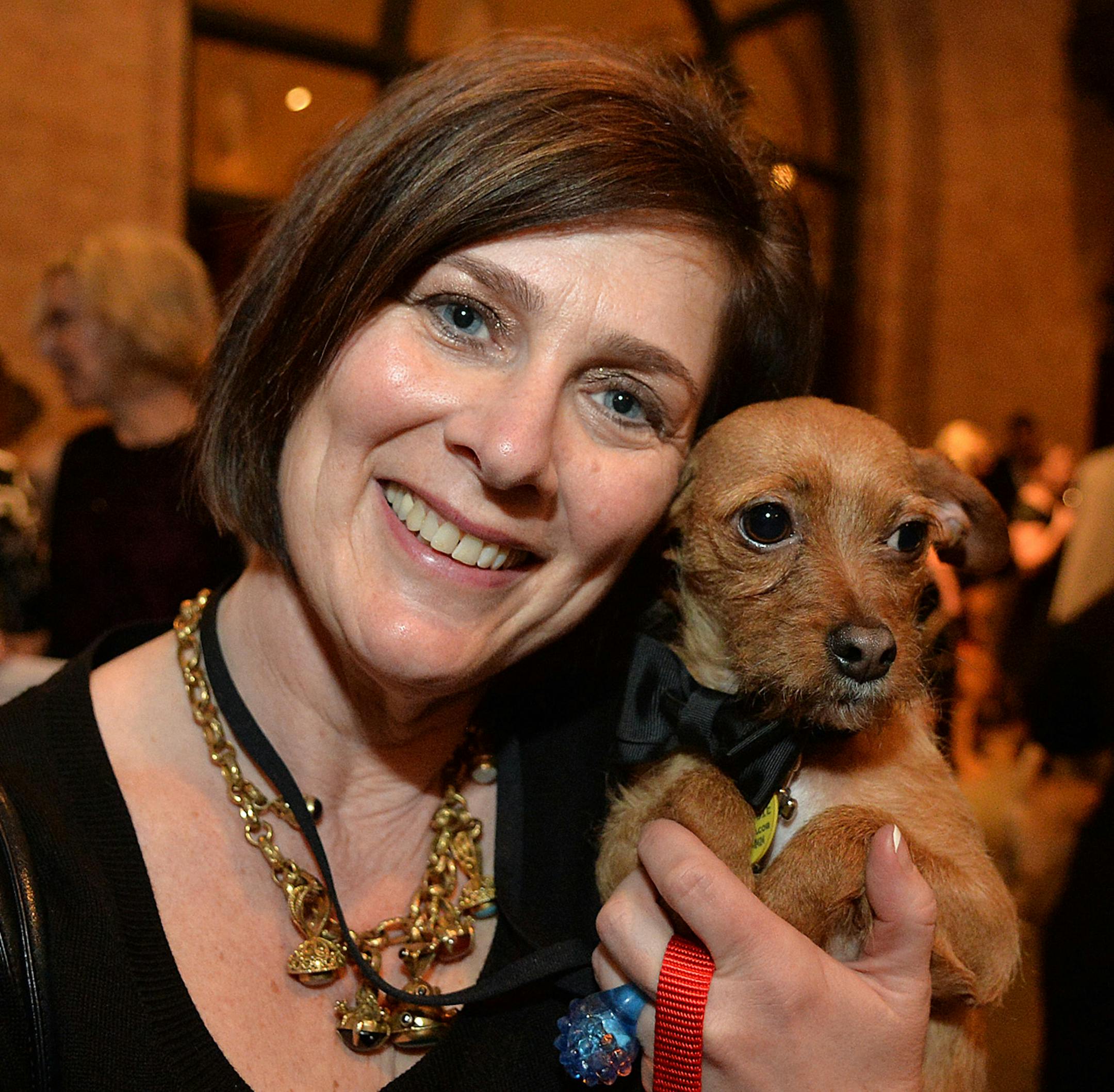 Animal Humane Society President and CEO, Janelle Dixon with Gryphon, a Chihuahua Terrier rescue dog from the Humane Society. ] (SPECIAL TO THE STAR TRIBUNE/BRE McGEE) **Janelle Dixon (Animal Humane Society President and CEO), Gryphon (Chihuahua Terrier rescue)