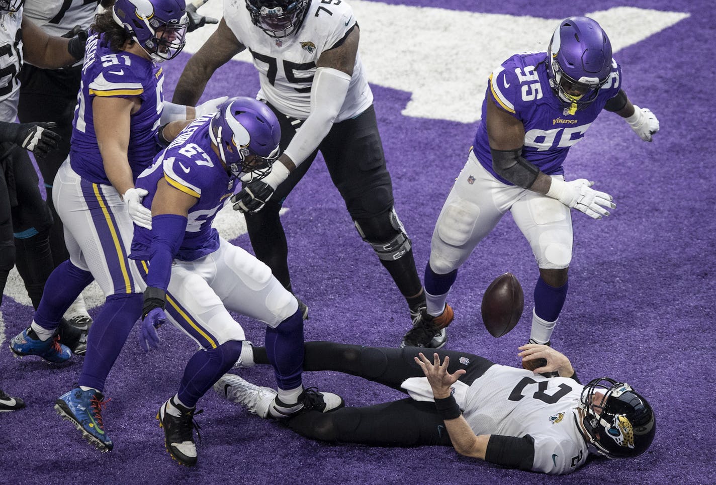 Jaguars quarterback Mike Glennon was flattened for a safety by Vikings defensive end Ifeadi Odenigbo (95) early in the fourth quarter but led a late drive to send the game into overtime.