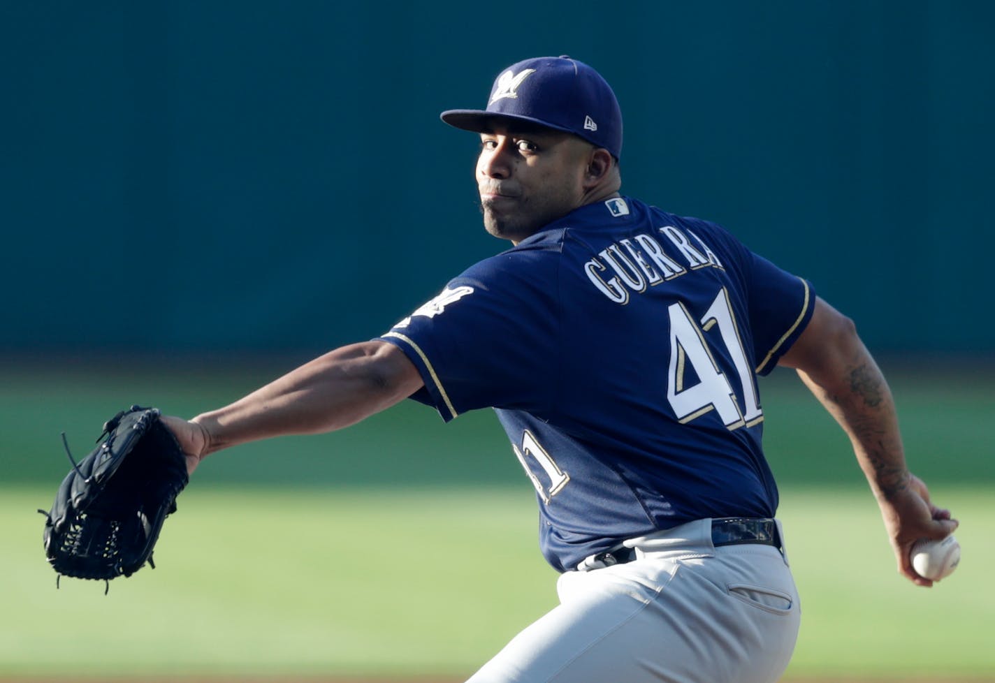 Milwaukee Brewers starting pitcher Junior Guerra delivers in the first inning of a baseball game against the Cleveland Indians, Tuesday, June 5, 2018, in Cleveland. (AP Photo/Tony Dejak)