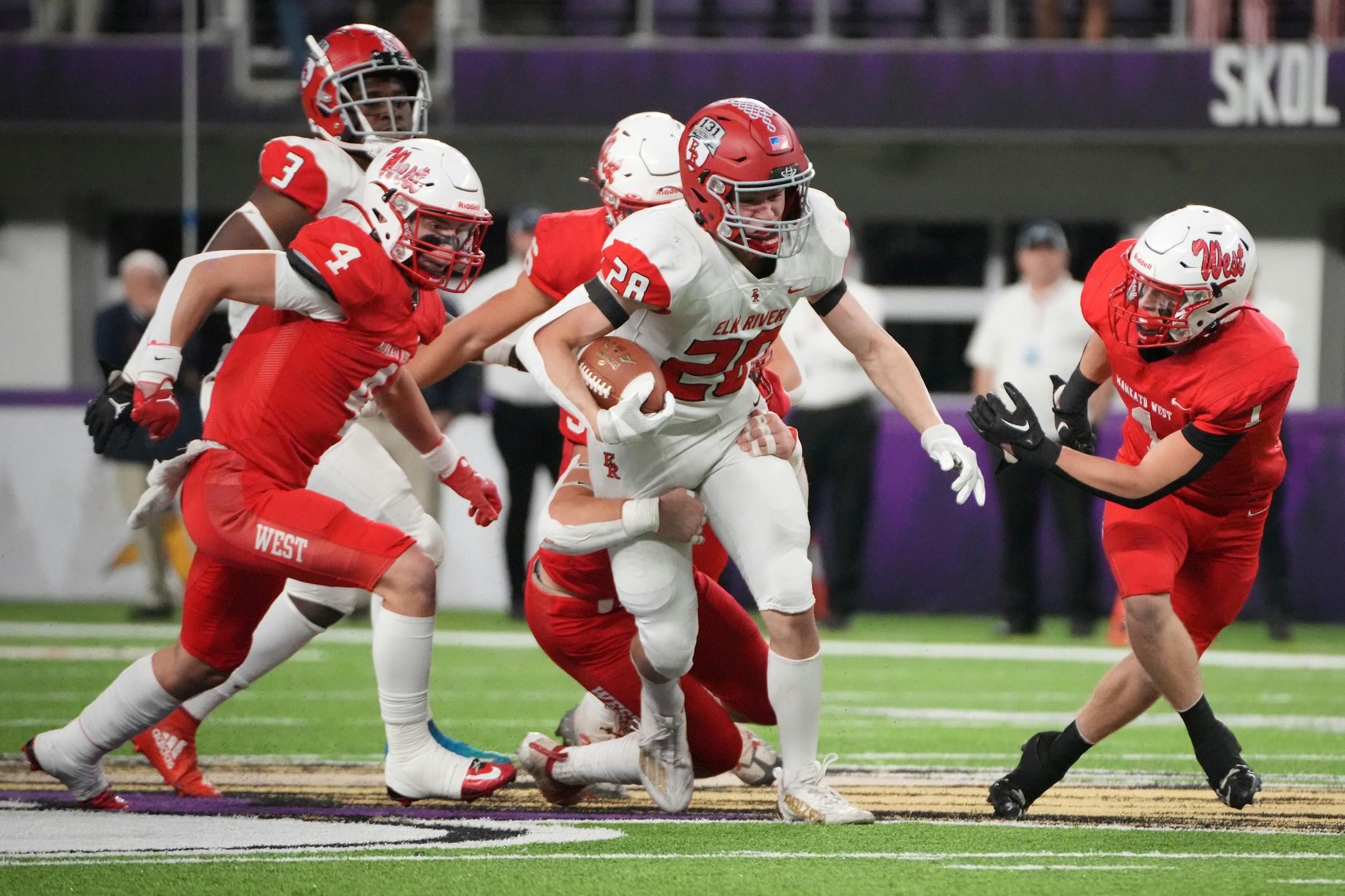 Elk River's Gavin Schmidt (28) rumbles for a first down in the first half of the Minnesota High School football Class 5A State Championship at U.S. Bank Stadium in Minneapolis, Minn., on Saturday, Dec. 3, 2022.