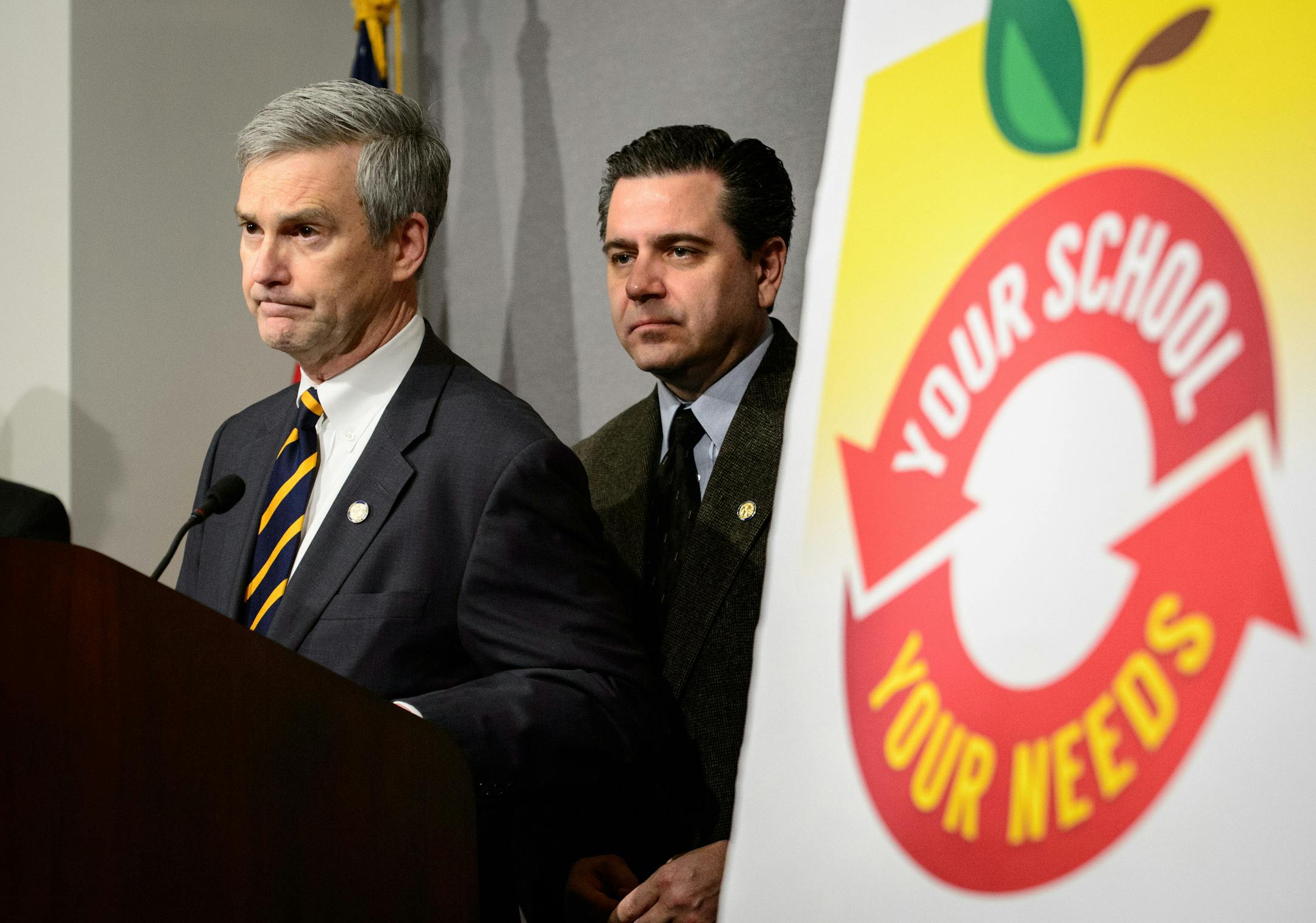 Sen. David Hann introduced a bill that would split the Minneapolis school district into six separate districts and six school boards. Sen. Sean Nienow, ranking member of education and E-12 finance committees, stands behind Hann.