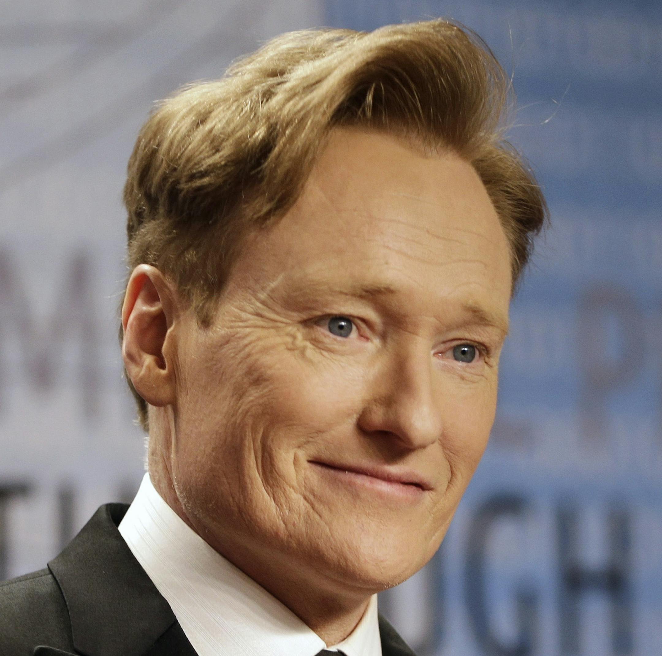 FILE - In this Dec. 12, 2013, file photo, talk show host Conan O'Brien arrives for the Breakthrough Prize in Life Sciences awards in Moffett Field, Calif. The TBS show "Conan" will be taped during 2015 Comic-Con International. The annual event runs July 9-12, 2015, at the San Diego Convention Center. (AP Photo/Ben Margot, File)