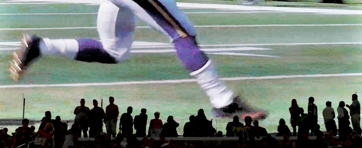 On a giant video monitor, Minnesota Vikings running back Adrian Peterson is seen on a highlight reel at the new U.S. Bank Stadium during an open house for the public Saturday, July 23, 2016, in Minneapolis, MN.