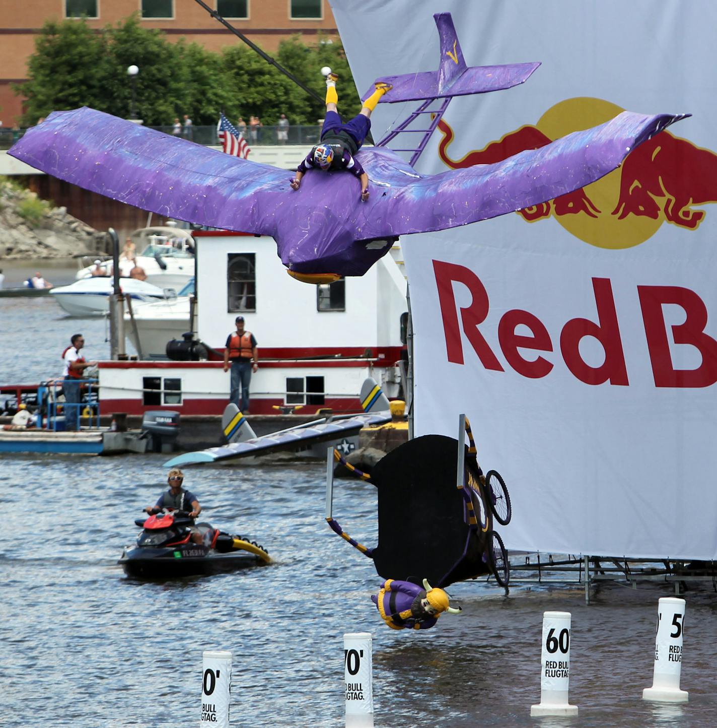 DAVID JOLES &#xa5; djoles@startribune.com - St. Paul MN - July 24, 2010- Red Bull Flugtag - an amateur flying competition - came to Harriet Island Park in St. Paul, with 37 teams with homemade, man-powered flying machines launched their crafts off a 30-foot platform and attempt to fly or crash in the Mississippi River. In this photo:]Team Favre's Wingmen plunge toward the water.