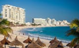 Resort hotels line the beach in Cancun, Mexico.