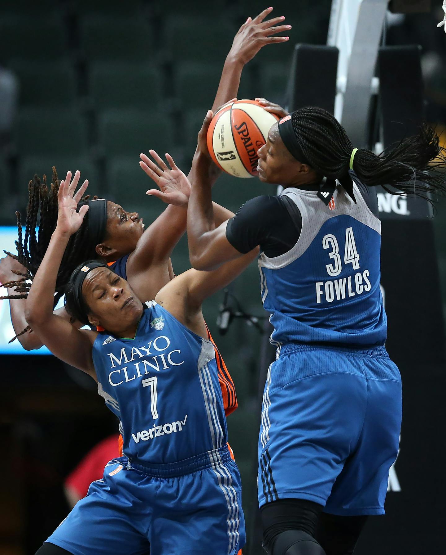 Minnesota Lynx center Sylvia Fowles (34) pulled down a defensive rebound as teammate Jia Perkins (7), boxed Connecticut Sun forward Jonquel Jones (35) out in the second half at Xcel Energy Center May 22, 2017 in St. Paul, MN. ] JERRY HOLT &#xef; jerry.holt@startribune.com