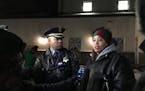 Minneapolis Police Chief Medaria Arradondo and Chauntyll Allen, an organizer with Black Lives Matter Twin Cities, spoke at a community holiday tree er