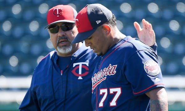 Eddie Guardado (left) is among the five coaches let go by the Twins.