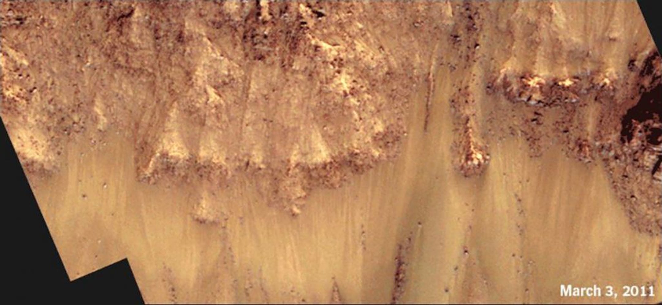 A time-lapse animation of Palikir Crater shows how the streaks extend and darken during warmer months on Mars, then gradually fade as temperatures cool. Image date March 3, 2011