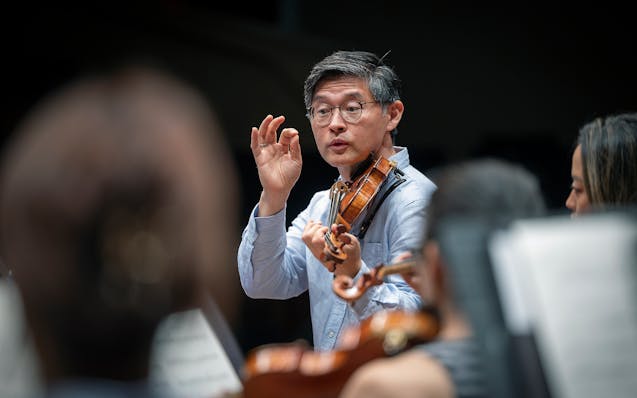 The St. Paul Chamber Orchestra artistic director Kyu-Young Kim helped lead a rehearsal in 2022. The chamber orchestra announced Friday that he would b