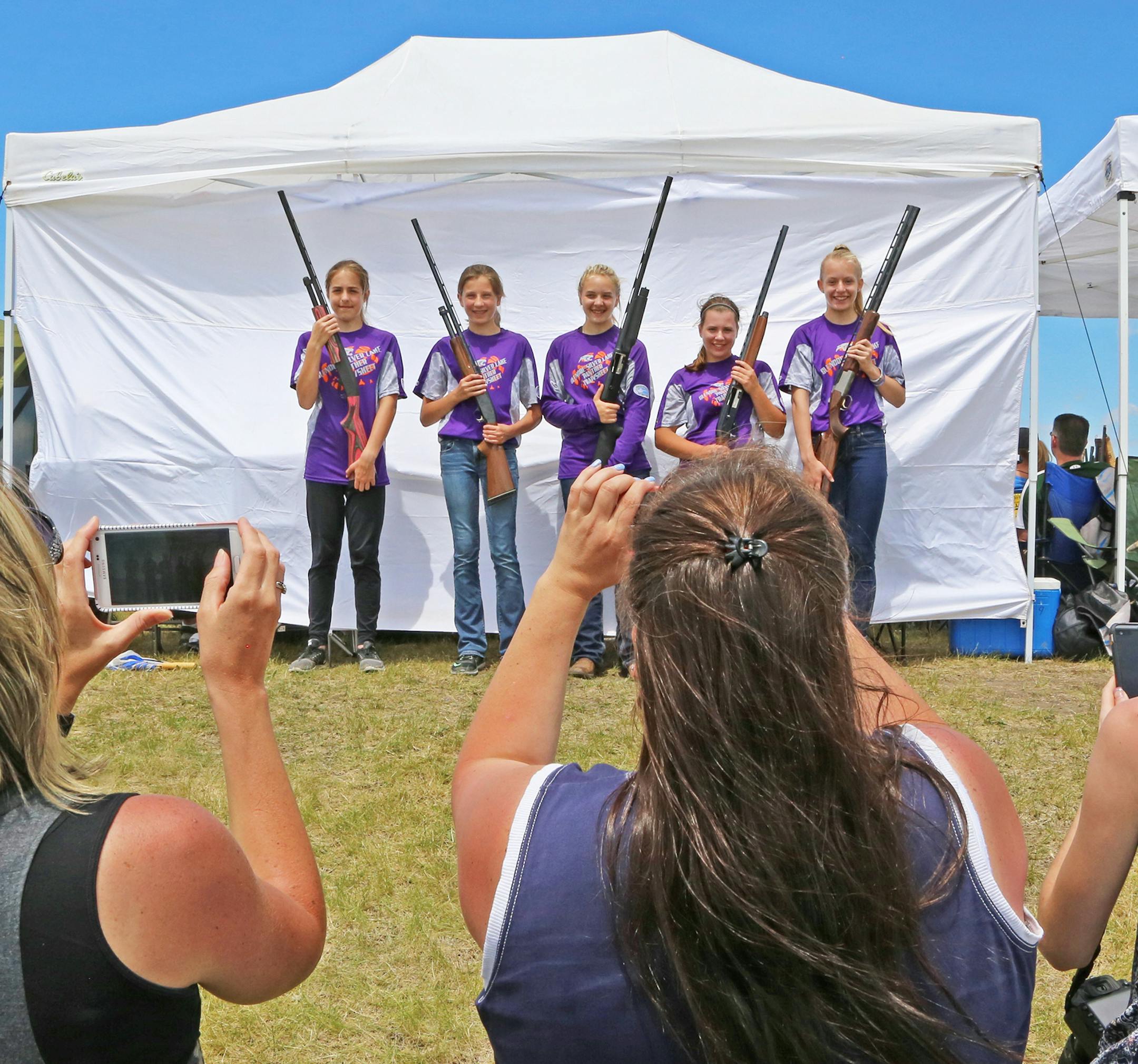 Seventh- and eighth-grade girls shooting for the Glenco-Silver Lake Novice 1 trapshooting team in Alexandria on Thursday were Paris Stradtmann, Lauren Bernstein, Kaitlyn Grack, Katelyn Dammann and Katrina Dummer. The proud mothers taking photos were part of the team's parent boosters featuring every, or nearly every, mother and father of students on the 39-member roster.