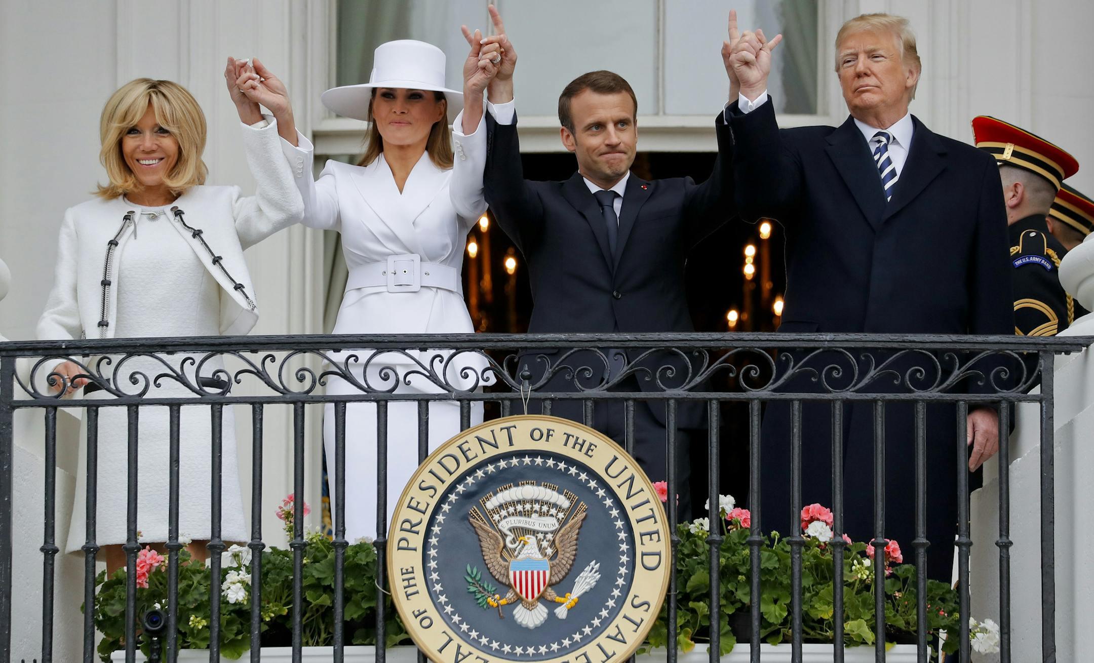 President Donald Trump, first lady Melania Trump, French President Emmanuel Macron and his wife Brigitte Macron stand on the Truman Balcony during a State Arrival Ceremony on the South Lawn of the White House in Washington, Tuesday, April 24, 2018. (AP Photo/Pablo Martinez Monsivais)