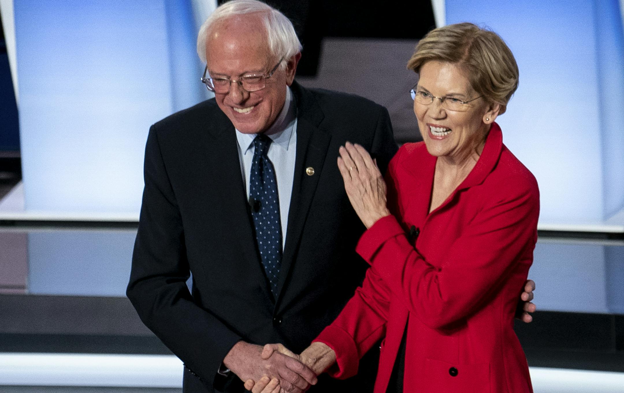 Sens. Bernie Sanders (I-Vt.) and Elizabeth Warren (D-Mass.) at the start of the first night of Democratic presidential debates at the Fox Theater in Detroit, July 30, 2019. (Erin Schaff/The New York Times)