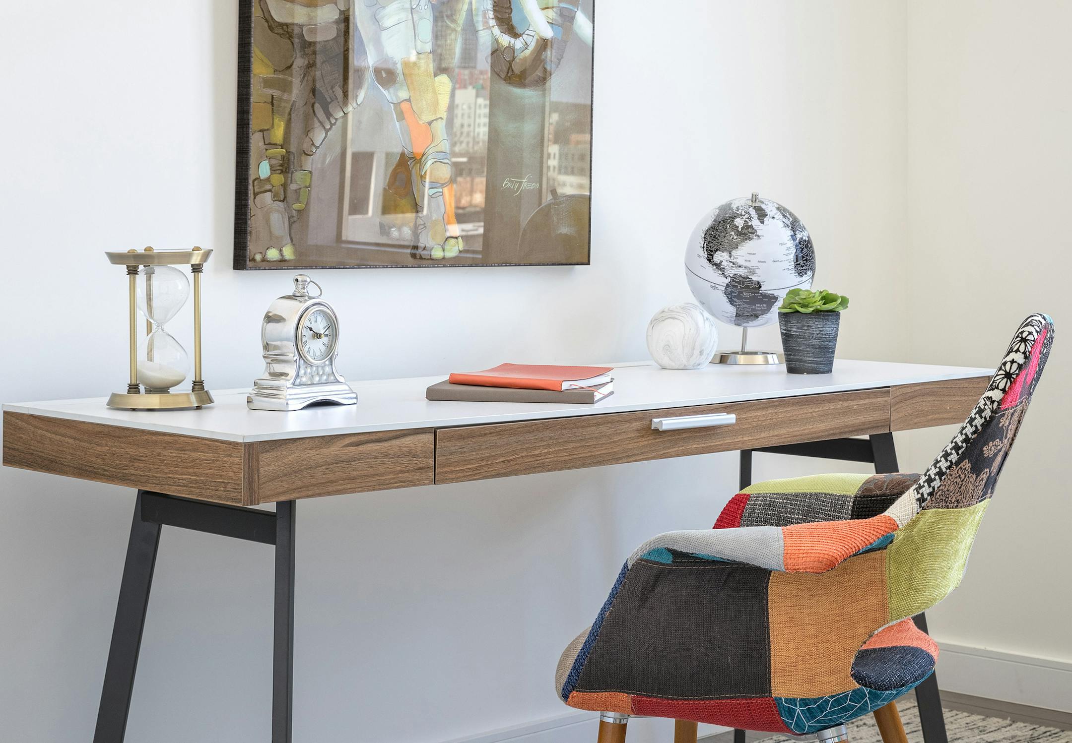 A mix of autumn-toned accents is used in both furniture and artwork to add comfort to the room. (Design Recipes/TNS)