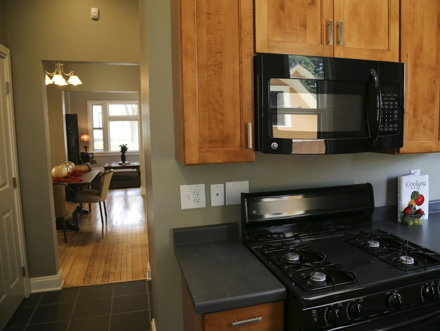 One of the formerly rundown properties in the Dayton's Bluff historic district has been staged for the market and features the original birch floors, restored as well as a completely new kitchen and was seen Thursday, Aug. 1, 2013. ](DAVID JOLES/STARTRIBUNE) djoles@startribune.com Four years ago, St. Paul stuck its neck out to buy 11 rundown properties in the Dayton's Bluff historic district of little interest to private investors or developers. Now the first four of those homes have been restor