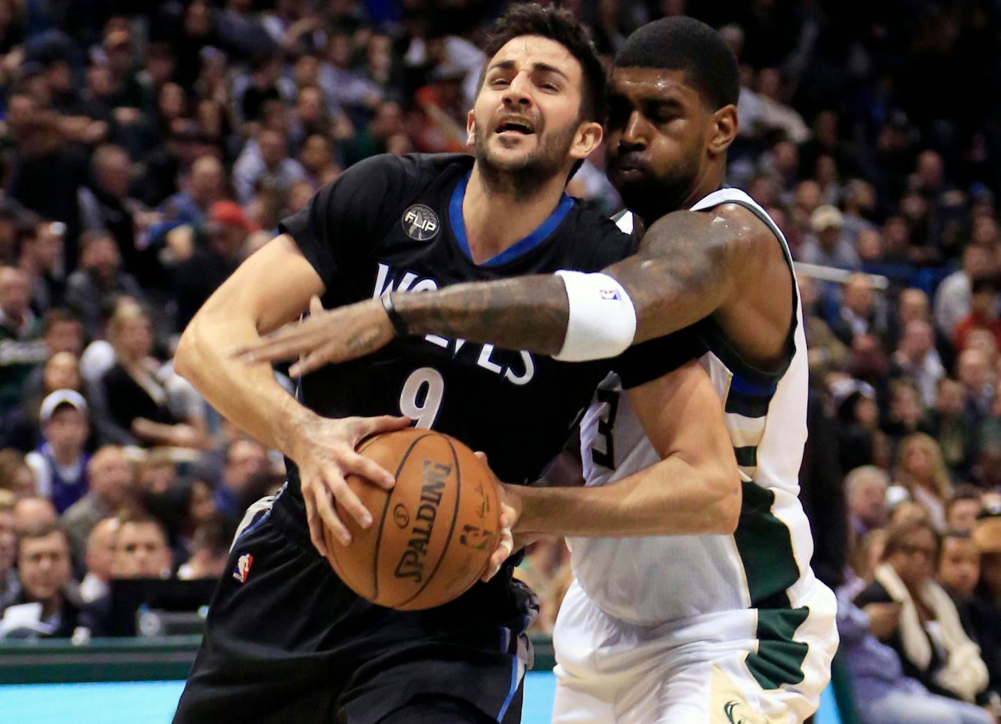 Milwaukee Bucks guard O.J. Mayo, right, fouls Minnesota Timberwolves guard Ricky Rubio, left, during the first half of an NBA basketball game Friday, March 4, 2016, in Milwaukee. (AP Photo/Darren Hauck)