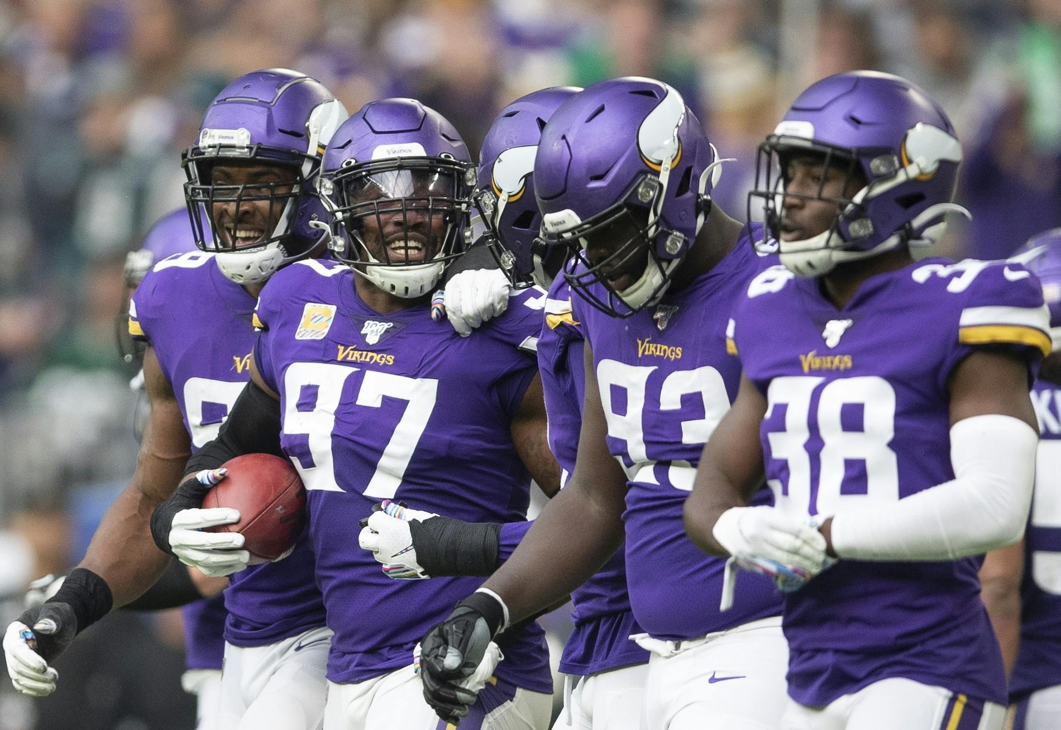 Minnesota Vikings defensive end Everson Griffen (97) celebrated his second quarter interception with teammates at U.S. Bank Stadium.