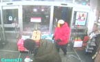 One of the suspects in the robbery of a Walgreens pharmacy in Edina is shown entering the store in this surveillance photo. The suspect is wearing a s