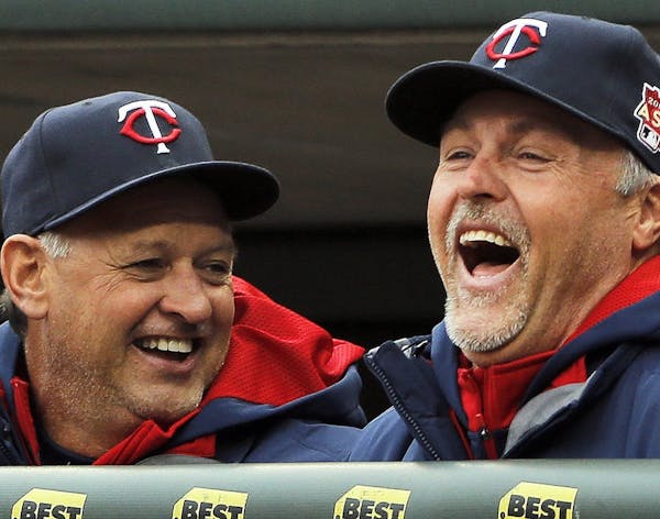 Minnesota Twins coaches Terry Steinbach, left, and Tom Brunansky share a laugh during the game against the Kanaas City Royals at Target Field in Minne
