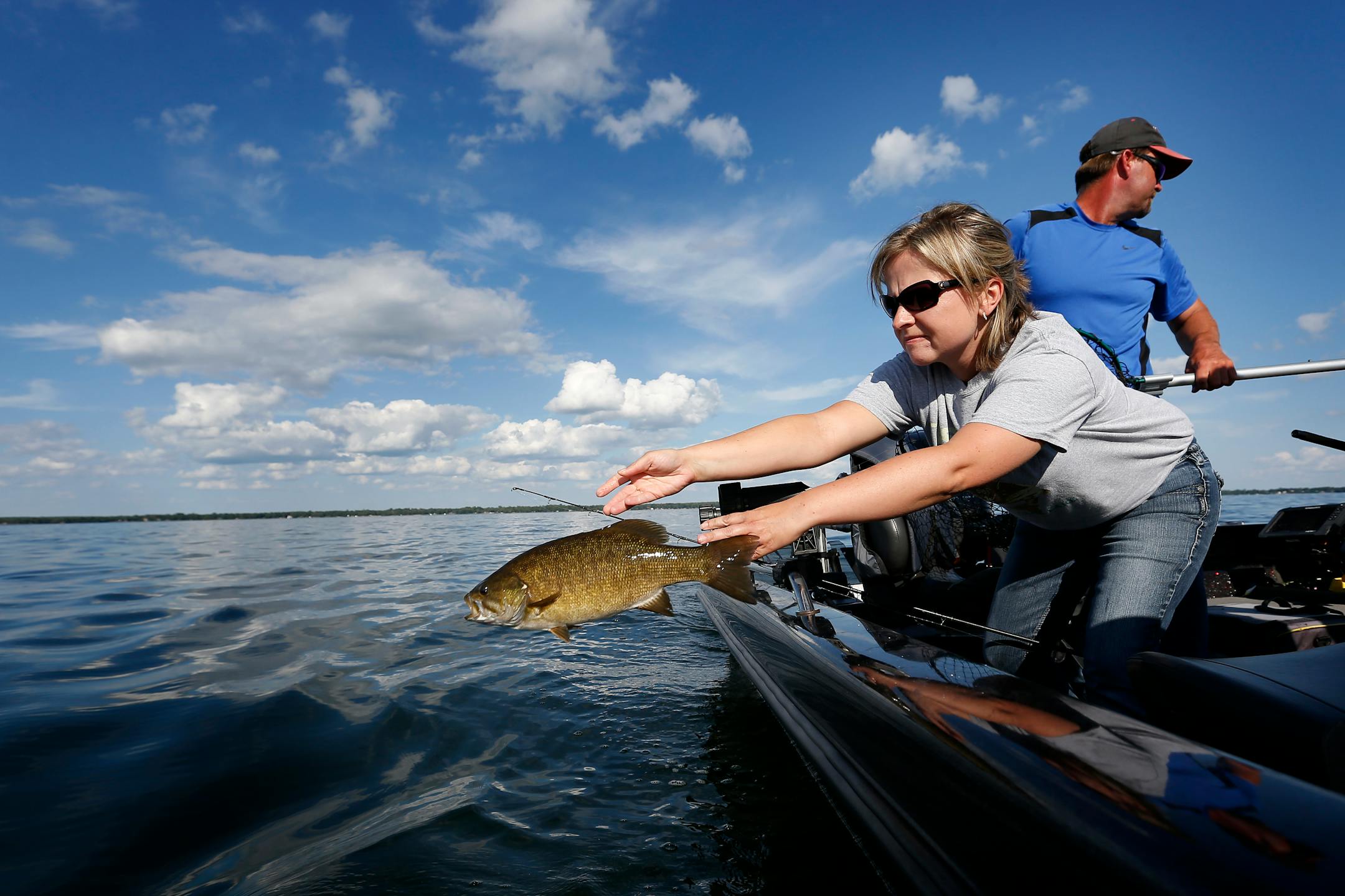 Suzy Anderson tossed back a smallmouth bass into Lake Mille Lacs in July of 2015.
