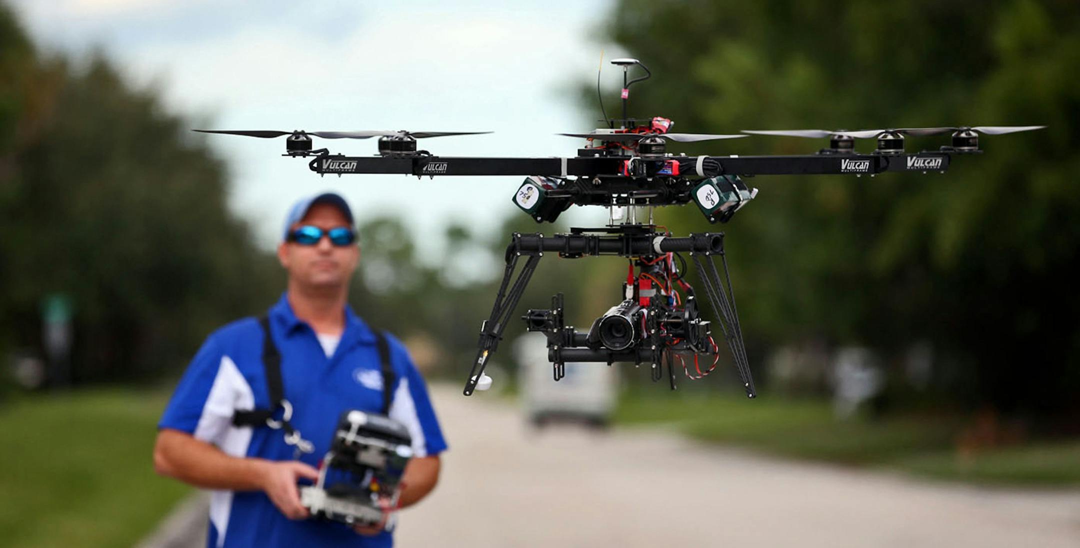 ReadyHeli.com technician and sales agent Brett Strand operates his own personal octacopter drone in Jupiter, Fla., Dec. 4, 2013. (Richard Graulich/Palm Beach Post/MCT) ORG XMIT: 1146564