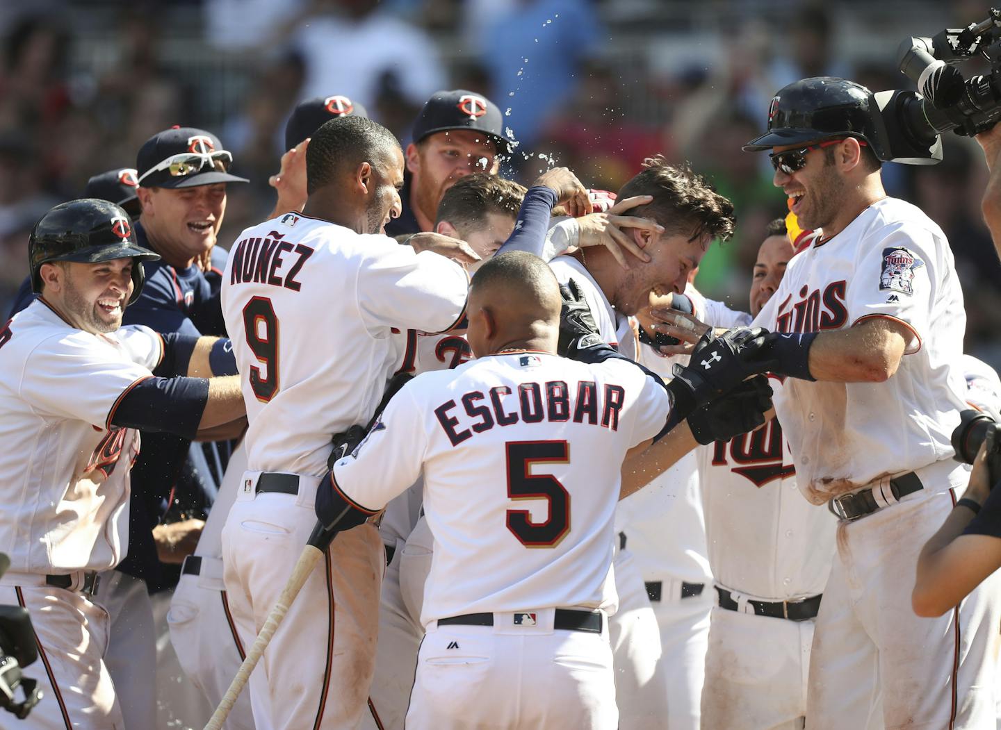 The Twins' Max Kepler mobbed by teammates after his three run homer won the game in the 10th inning Sunday afternoon. ] JEFF WHEELER &#xef; jeff.wheeler@startribune.com The Twins closed out their series with a 7-4 win over the Boston Red Sox in 10 innings Sunday afternoon, June 12, 2016 at Target Field in Minneapolis.