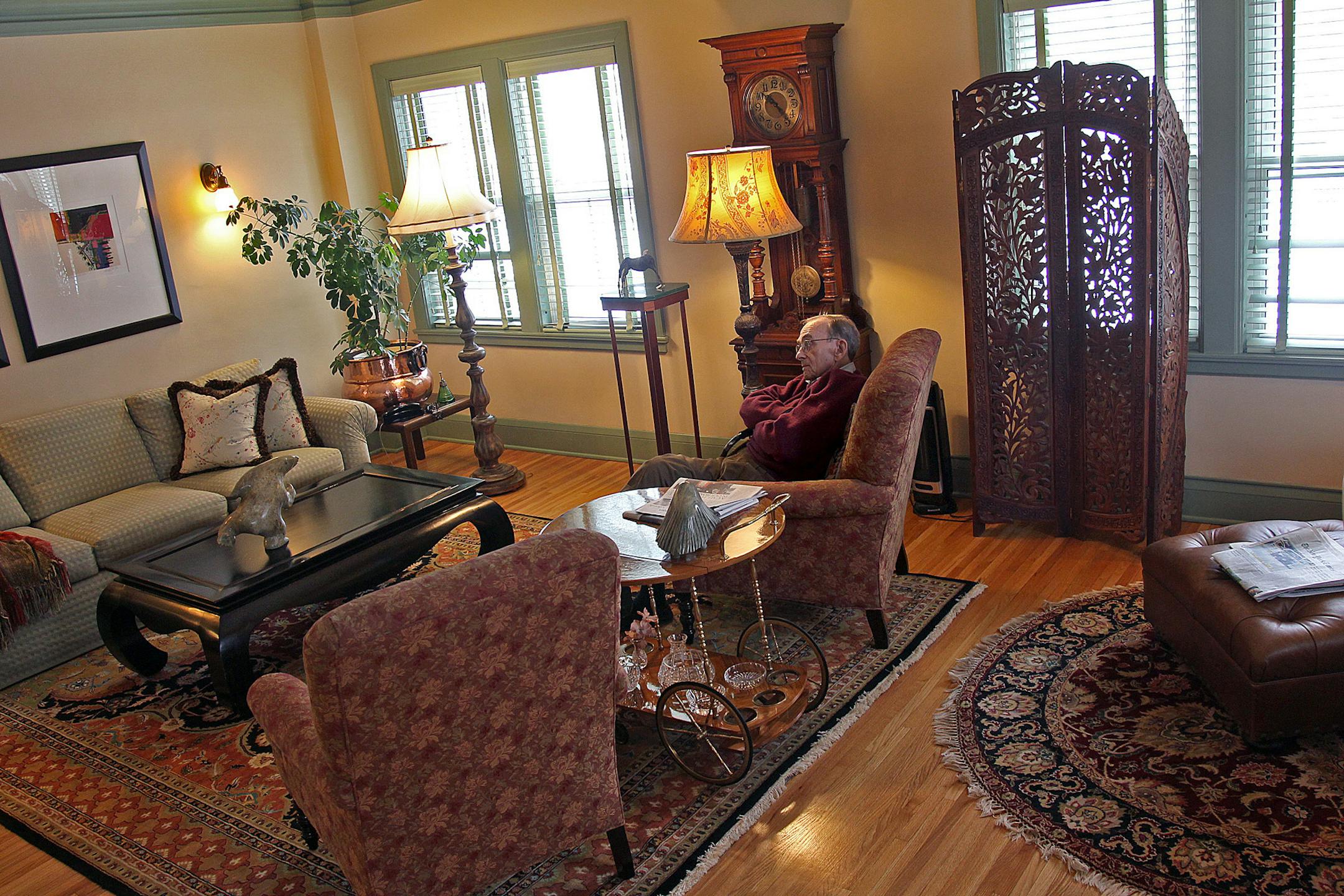 Jack Halloran relaxed in the living room area of his home. Halloran and Ursula Walsh are residents who have renovated their units at a historic Art Deco condominium building on Park Avenue in Minneapolis, Friday, February 8, 2013. (ELIZABETH FLORES/STAR TRIBUNE) ELIZABETH FLORES • eflores@startribune.com